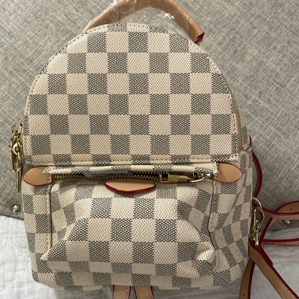 White checkered backpack, purse